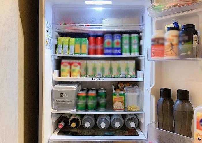 Drinks in the fridge with labels facing outwards.