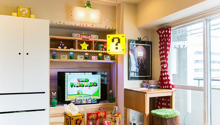 Media console decorated with Super Mario memorabilia