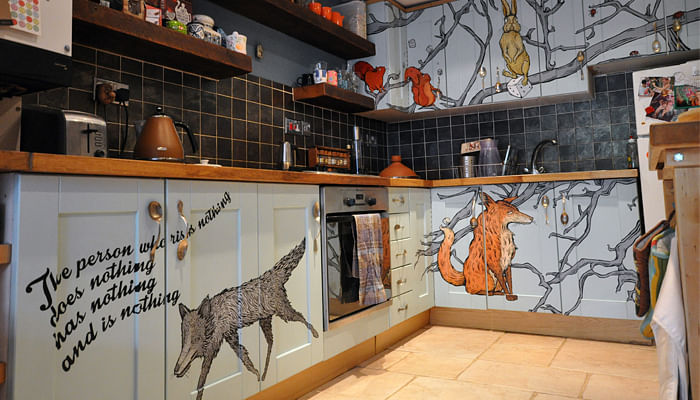 kitchen with animal drawings on the cabinets