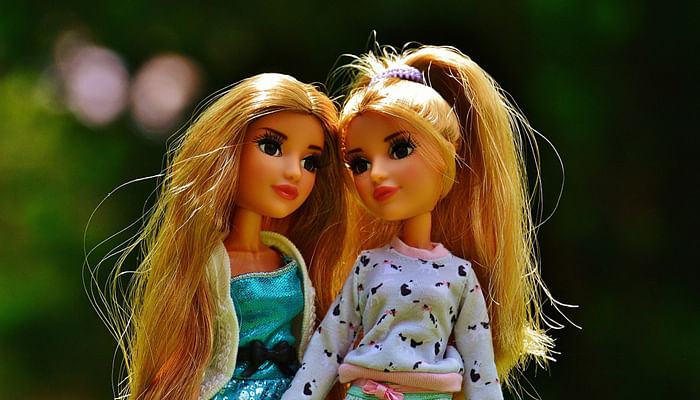 two barbie doll friends