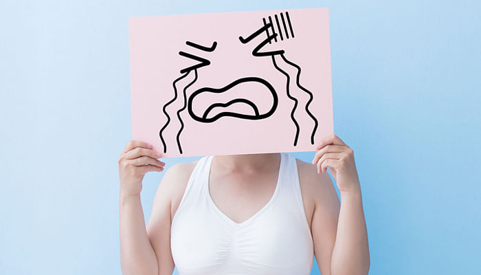 woman take crying billboard and body with blue background-asian