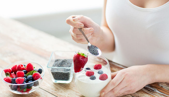 woman-eating-chia-seeds-with-yoghurt-and-berries-diet